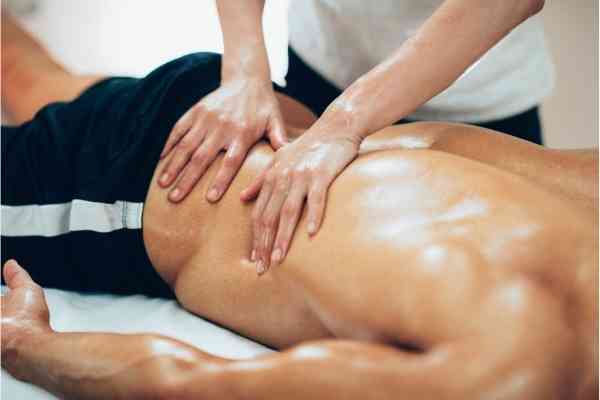 Revamp Sports Massage Therapist treating athlete with massage therapy in Colorado Springs